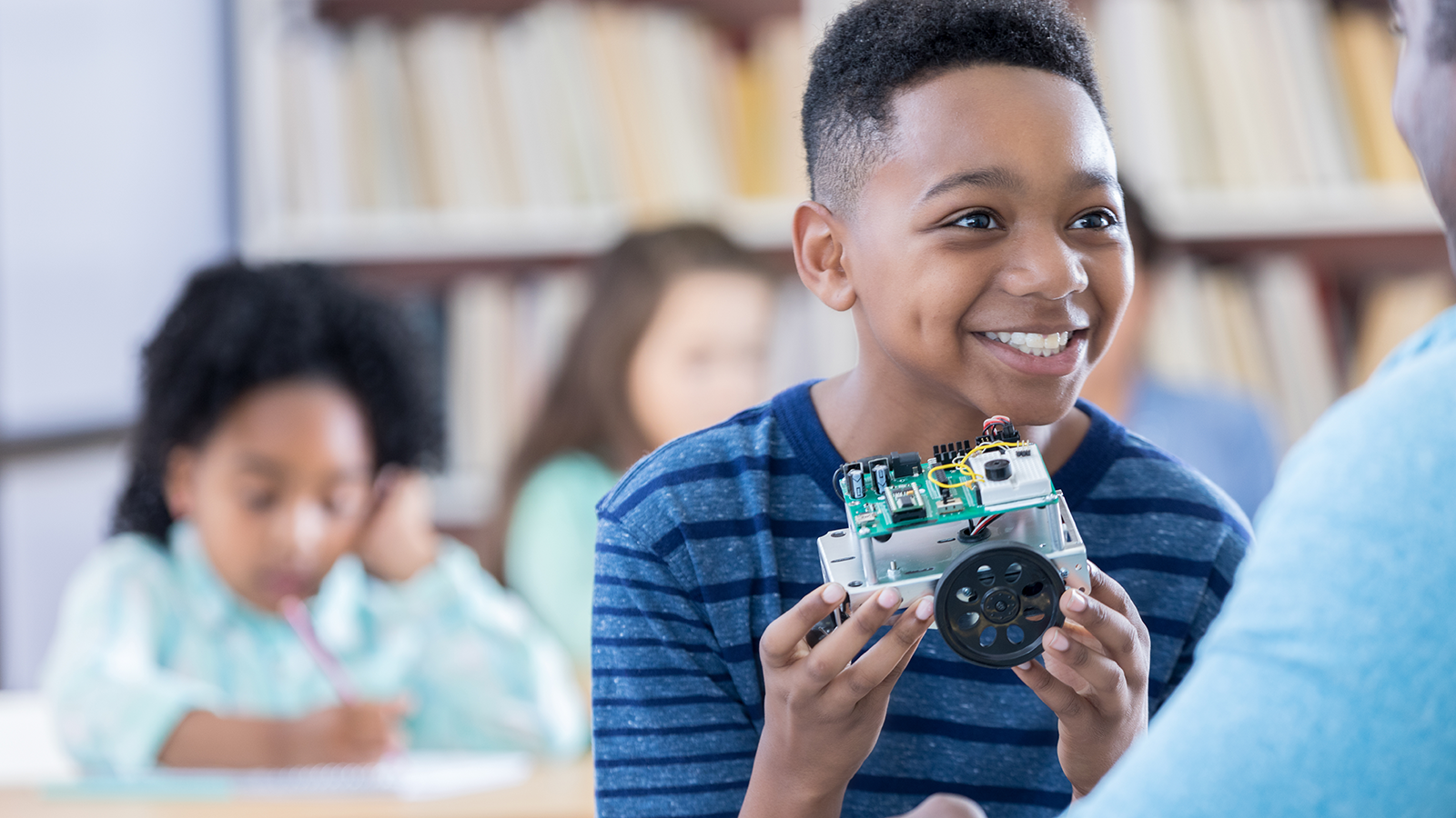 Students studying Amazon-supported computer science courses to prepare for the jobs of the future. 