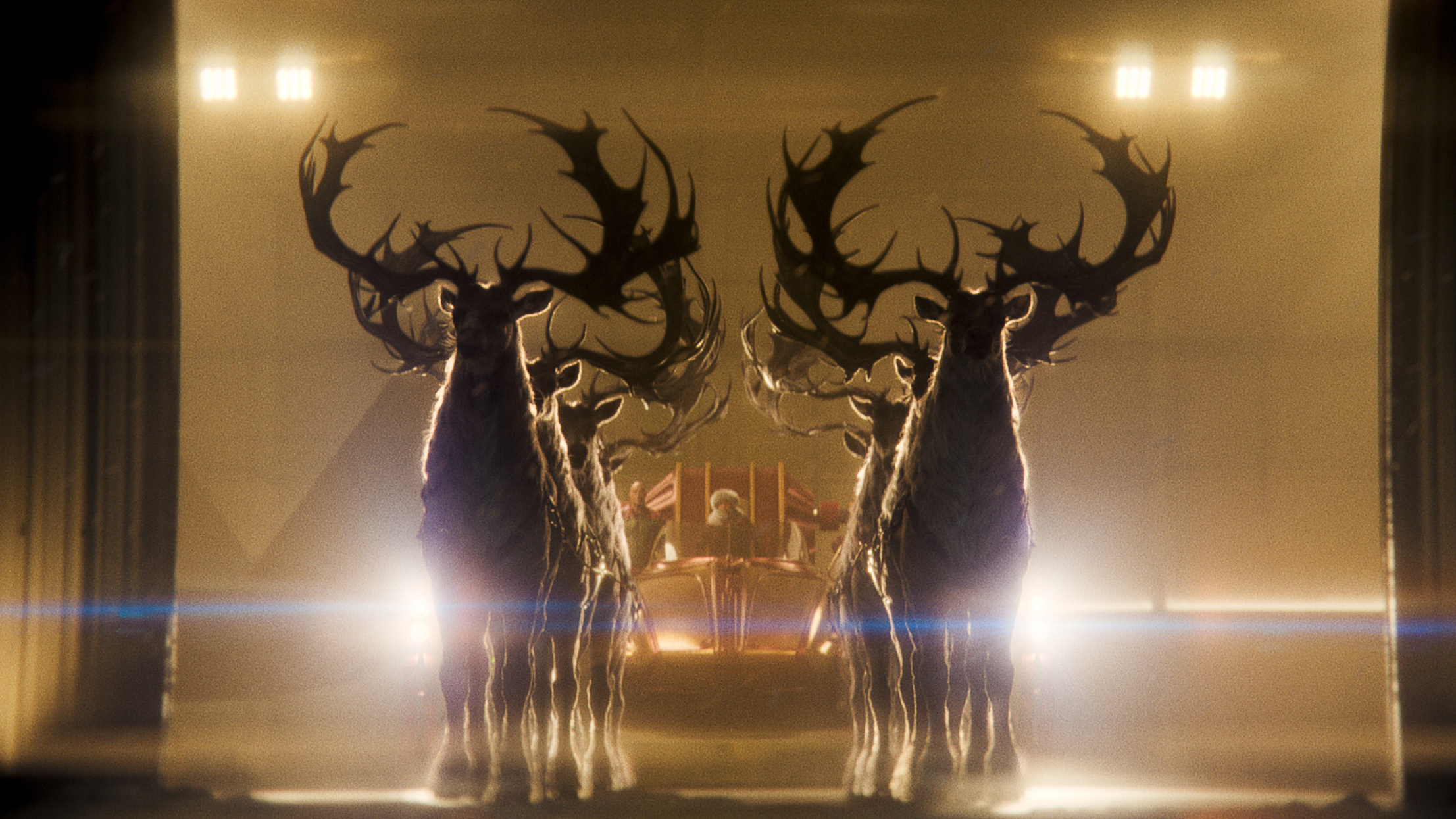 Red One: Two majestic stags with large antlers silhouetted in dramatic golden light