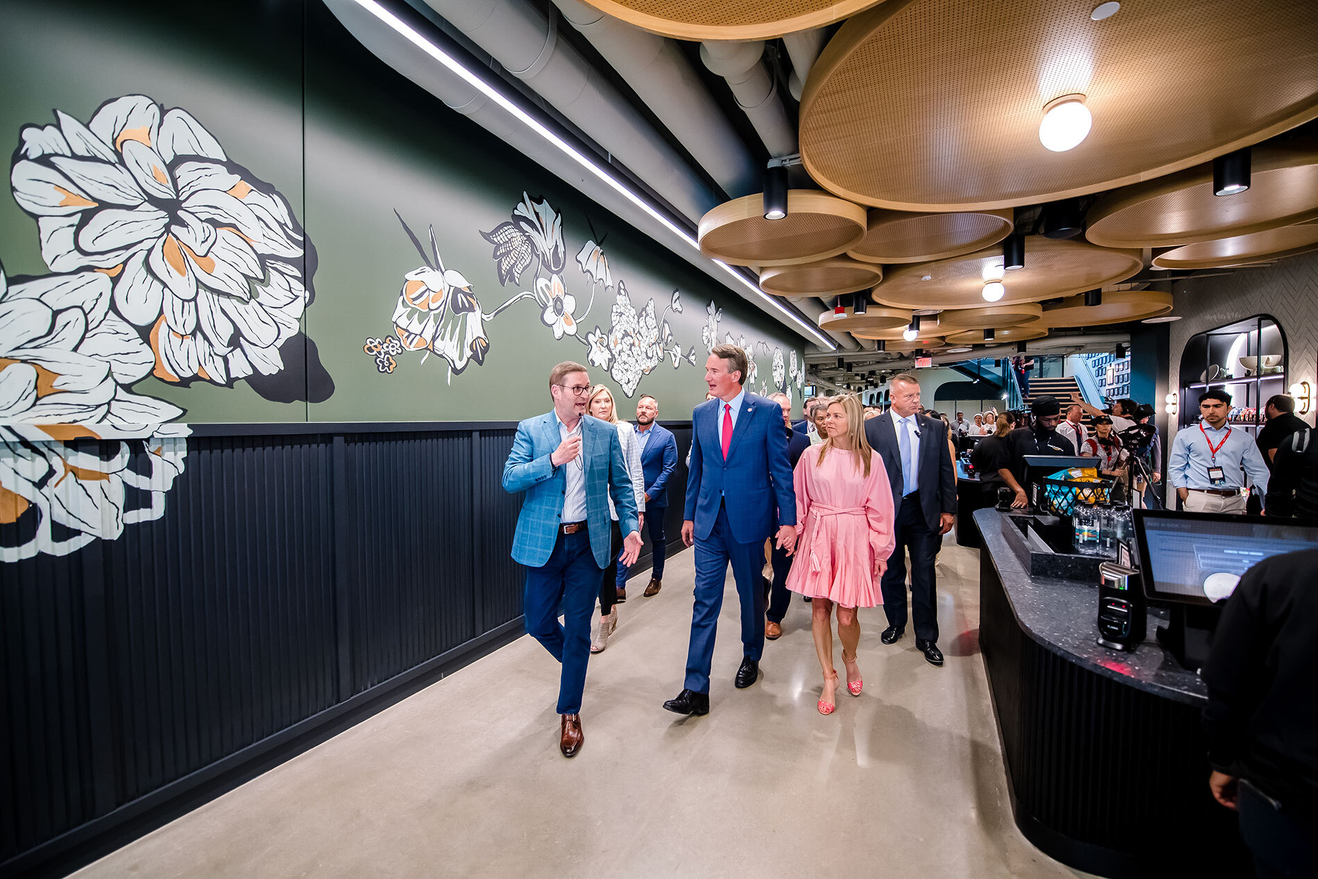 An image of local officials touring Amazon's second headquarters on its opening day