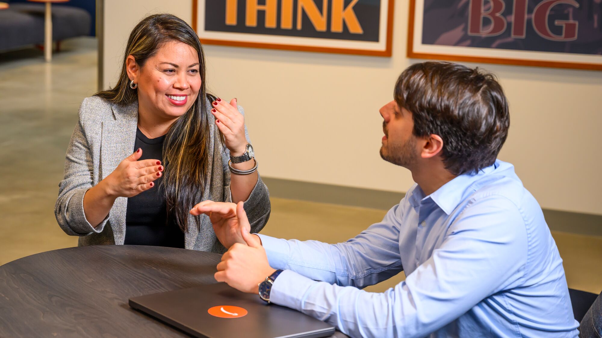 A woman and a man talking during an interview.