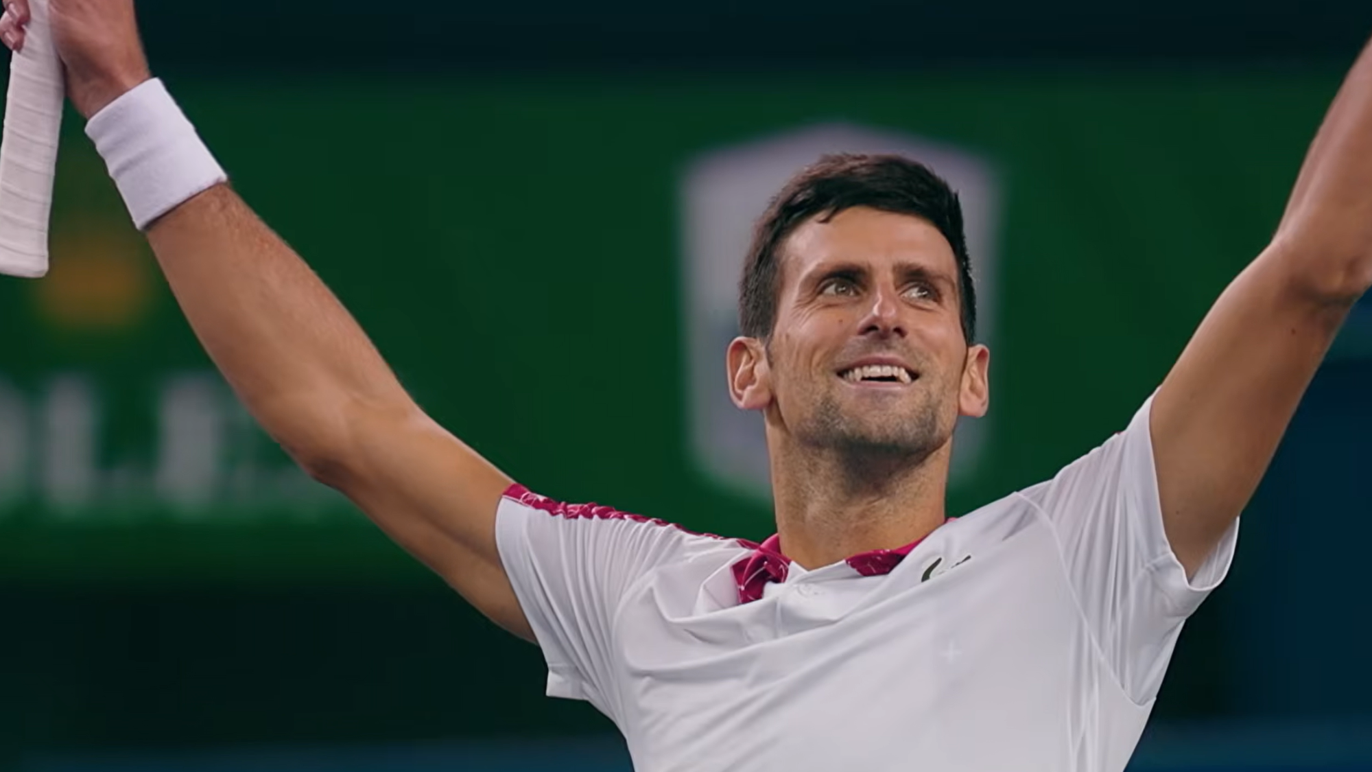 Novak Djokovic celebrating a win on the tennis court.