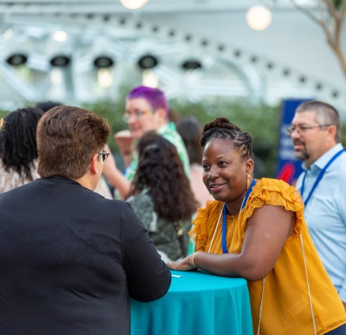 Amazon Future Engineer Teacher Ambassadors networking at an event. 